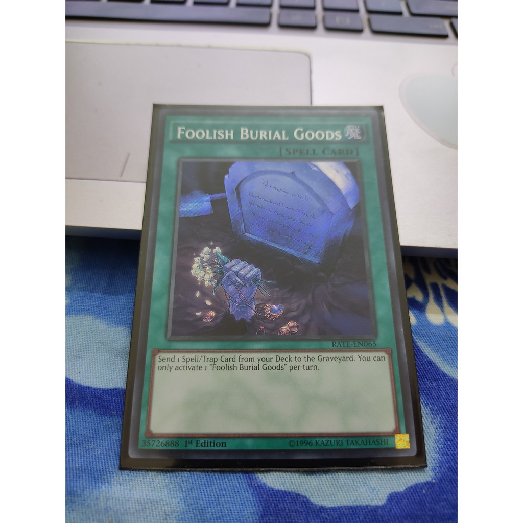 [Yugioh Funny Shop] Foolish Burial Goods – RATE-EN065 – Secret Rare 1st Edition