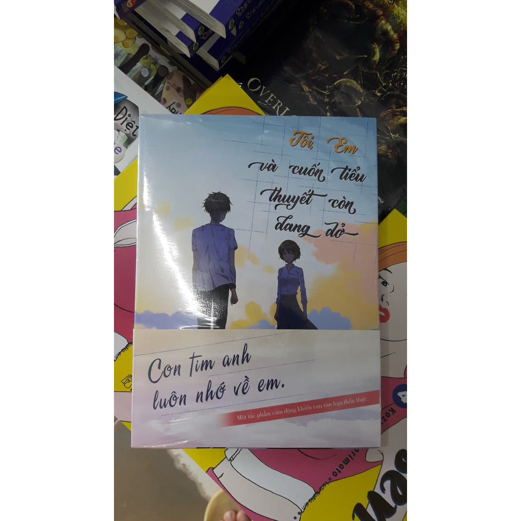 Sách - Tôi, Em Và Cuốn Tiểu Thuyết Còn Dang Dở - Tặng Kèm Bookmark Bo Hình + Đai Obi Bao Sách + Postcard (9x15cm)