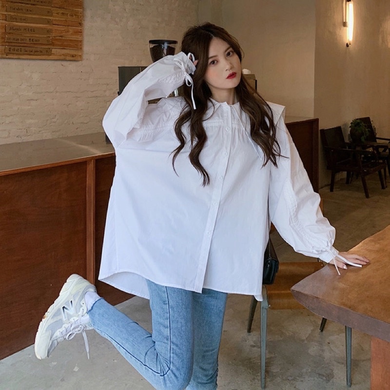 Áo sơ mi màu xanh da trời lỏng lẻo phong cách thiết kế lười biếng thích hợp Pháp tay áo phồng