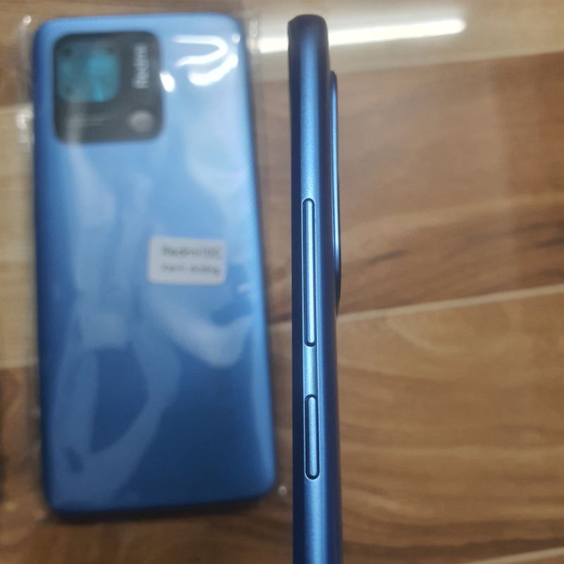 Nắp lưng Redmi 10C có bấm nguồn âm lượng,kính camera sau redmi 10c