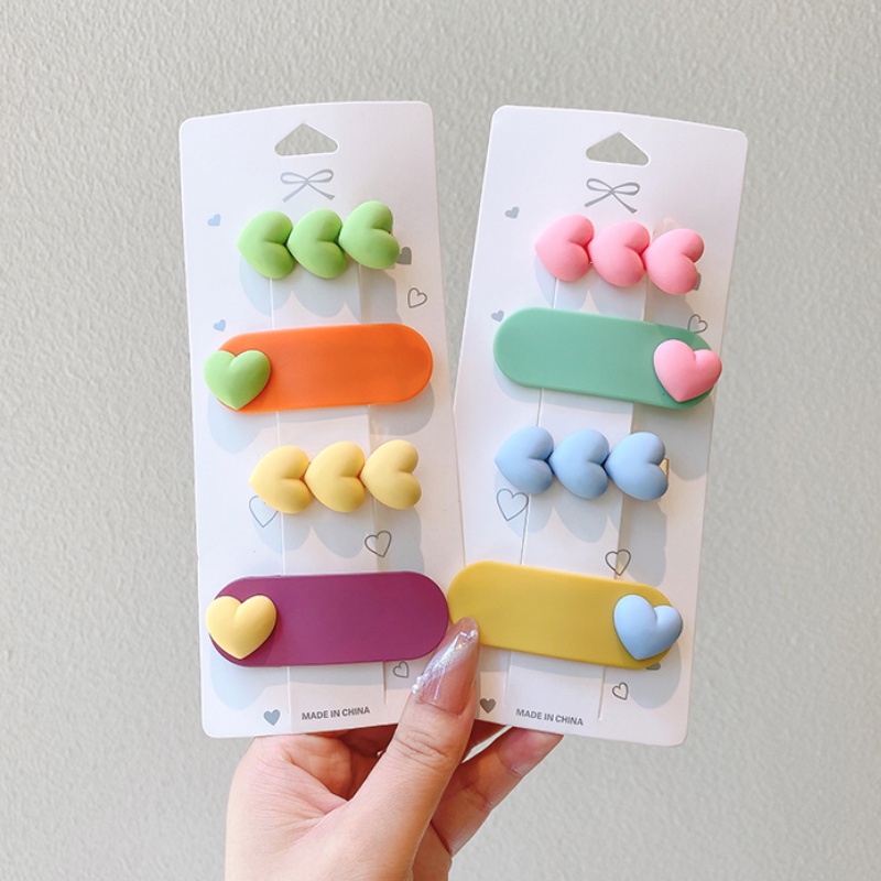 Kẹp tóc nhựa hình trái tim màu sắc đơn giản cho bé