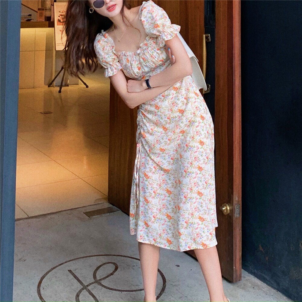 đầm suông bông lụa xẻ tà cổ trễ vai ngắn tay