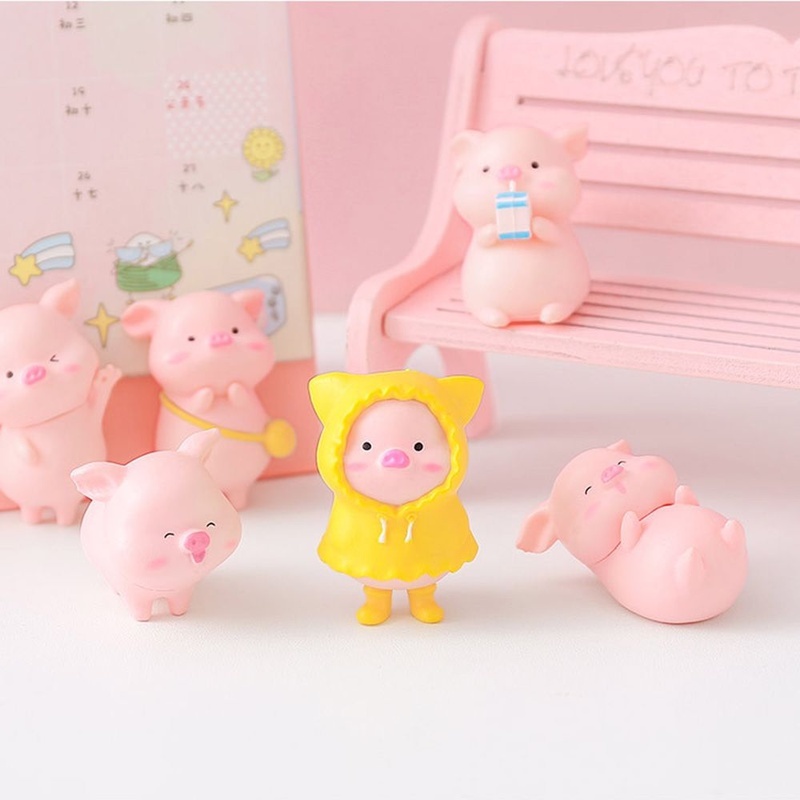 Chú heo mặc áo mưa mini màu vàng dùng trang trí máy tính