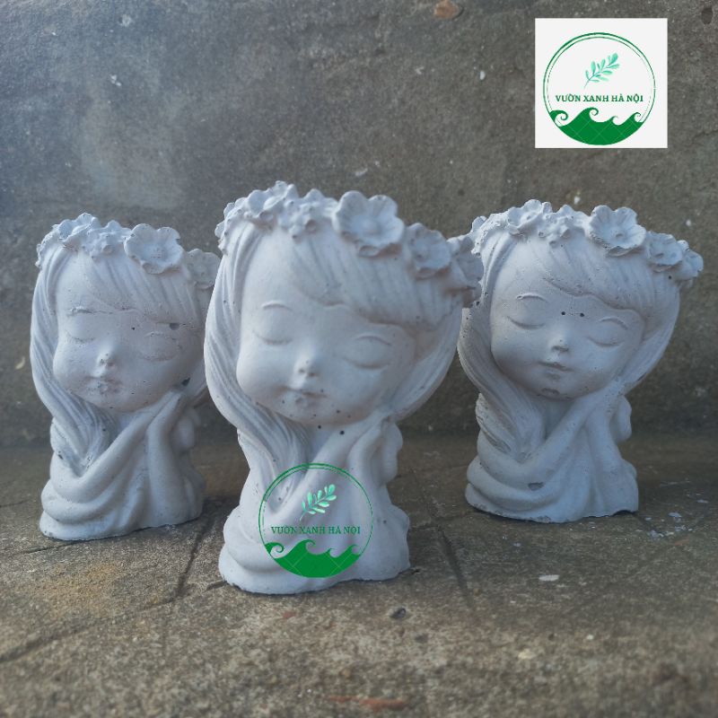 Chậu xi măng trồng sen đá, xương rồng hình cô gái đội hoa