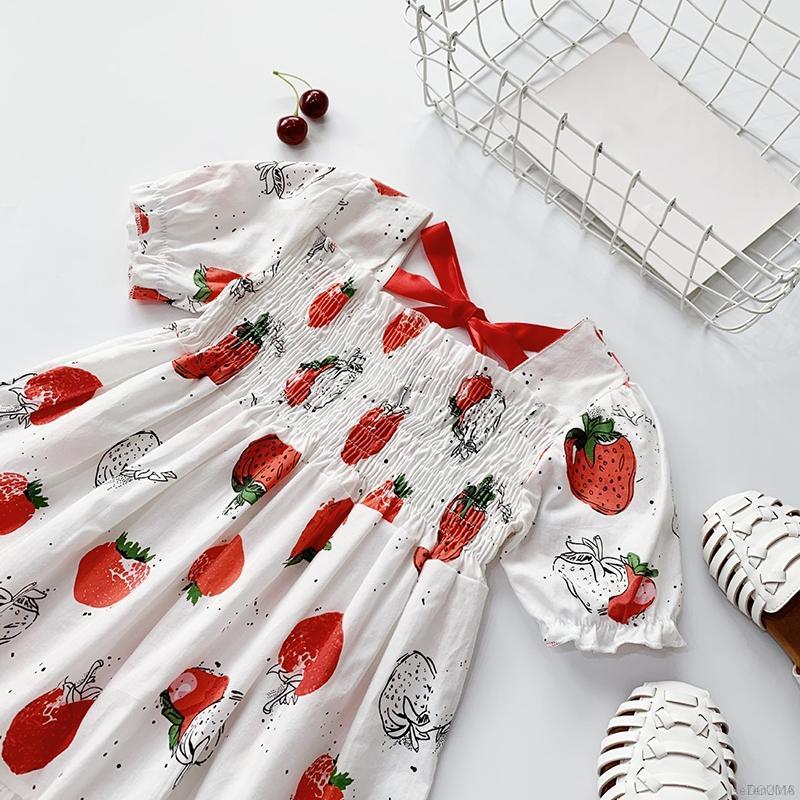 Đầm Tay Phồng Phối Nơ Họa Tiết Dâu Tây Đáng Yêu Cho Bé Gái