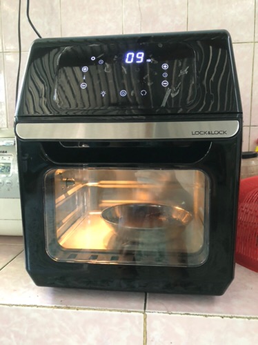 An aerial view of waves crashing against a shore.