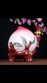 Bình gốm đào tiên đựng rượu