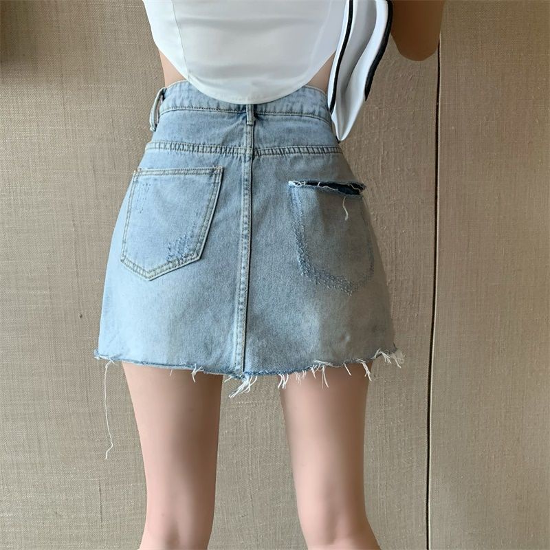 Chân váy denim siêu ngắn ngang hông cạp cao phối lỗ không đồng đều phong cách mùa hè 2022 cho nữ