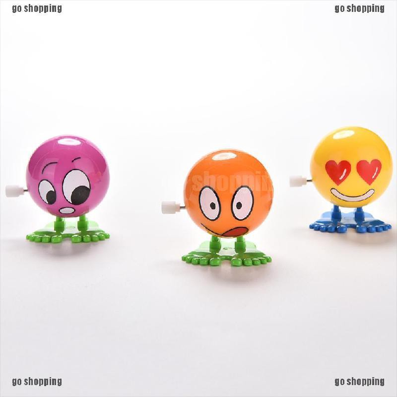 {go shopping}1 Pcs Wind up Face Colorful Funny  Cartoon Somersault Running Clockwork  Toys