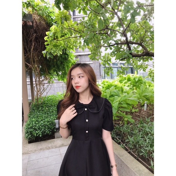 Đầm nơ viền chỉ