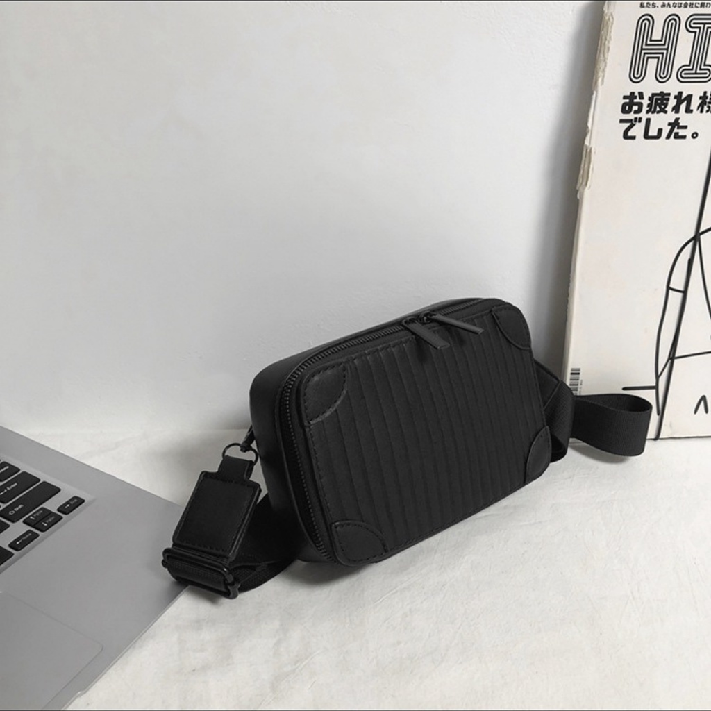 Túi đeo chéo dáng hộp unisex form cứng cáp màu đen và trắng