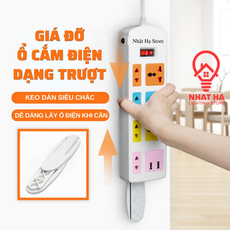 Giá đỡ ổ cắm điện dán tường Nhật Hạ. Miếng dán dạng trượt treo cục phát wifi, cố định remote tháo lắp tiện lợi.