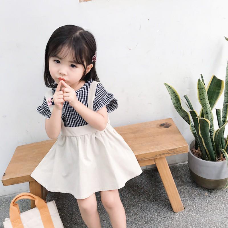 Set áo sơ mi ngắn tay + chân váy caro đính nơ dễ thương cho bé gái