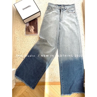 Quần jeans loang rách