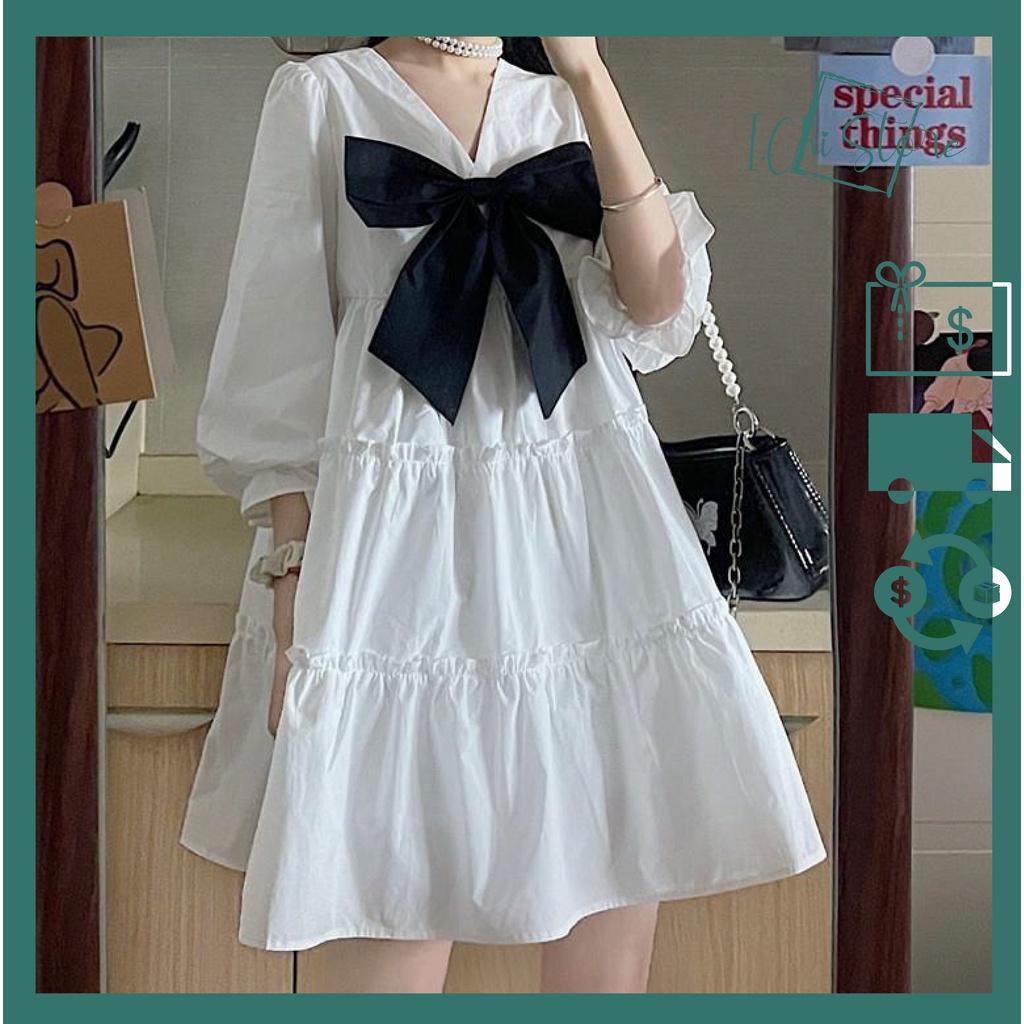 Váy trắng xòe phối nơ phong cách dễ thương dành cho nữ. Đầm Babydoll cổ V tiểu thư.