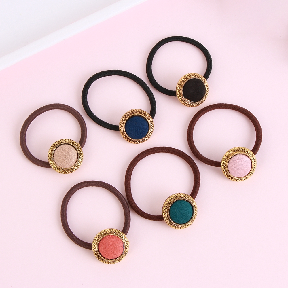 Cài tóc đính nút thời trang nữ tính