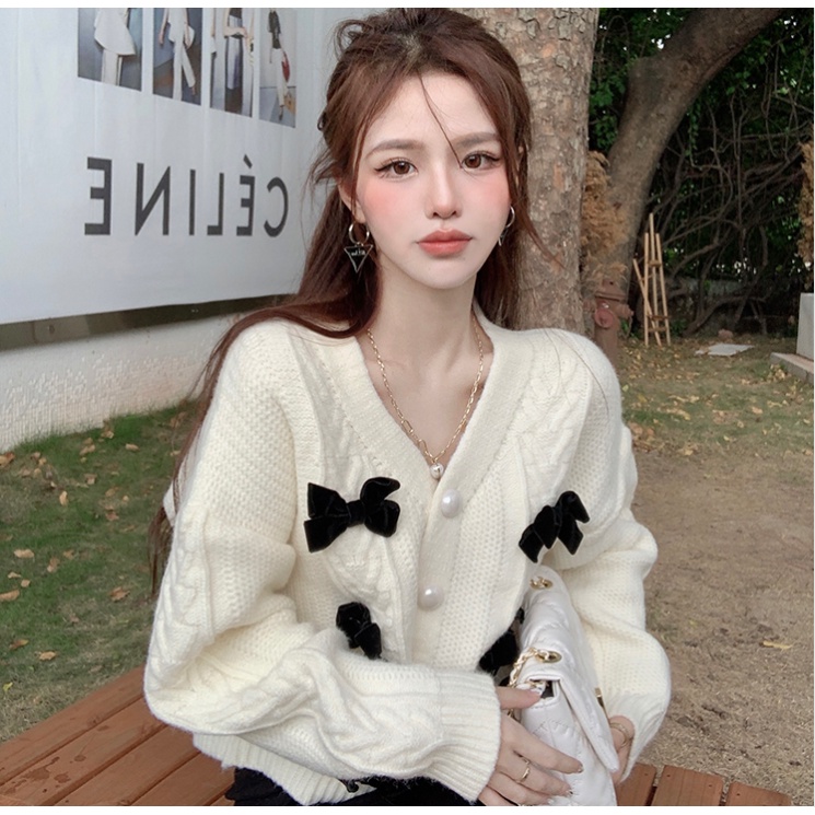 Áo len dáng rộng cổ V phối nơ mềm mại phong cách mùa thu 2021 cho nữ