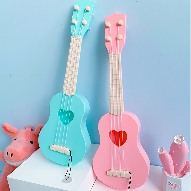 [HOT] Guitar đồ chơi trẻ em màu hồng dành cho bé gái ukulele người mới bắt đầu học chơi đánh đàn 2020