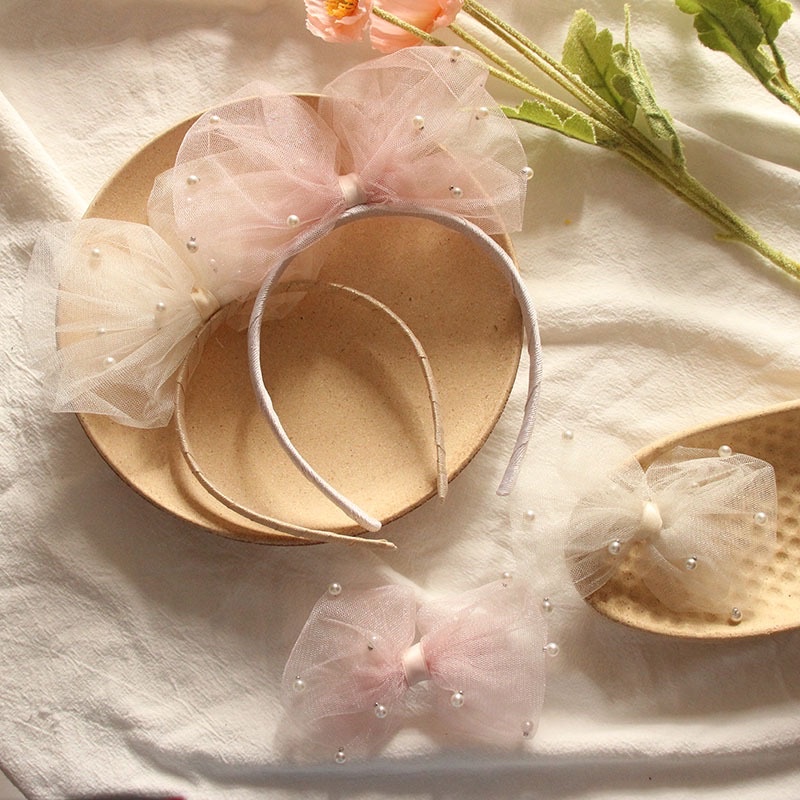 Bờm nơ to đính trai cho bé gái