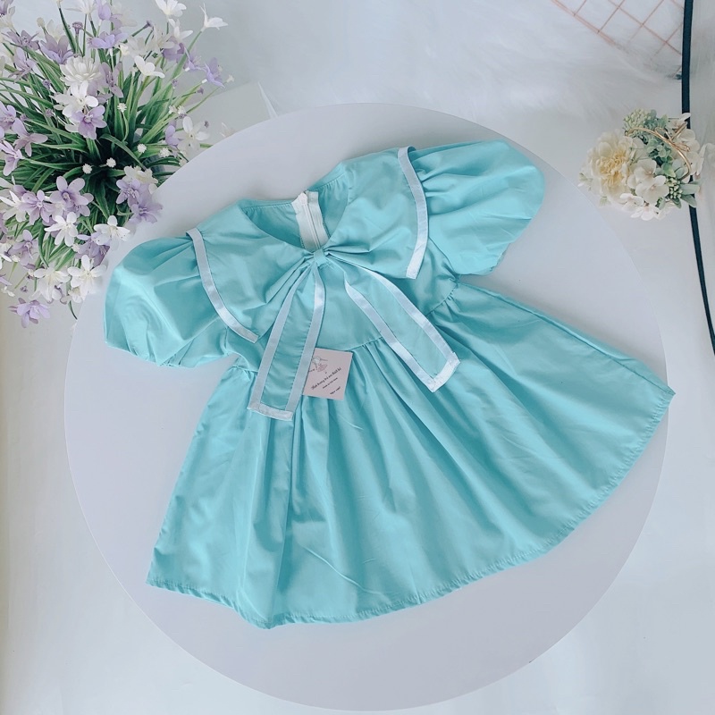 Váy bé gái đầm xanh ngọc phối nơ xinh cho bé