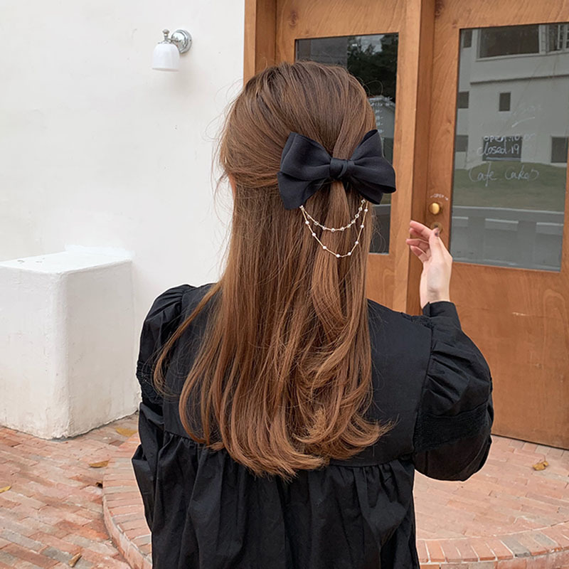 Kẹp tóc hình nơ đính ngọc trai nữ tính thời trang