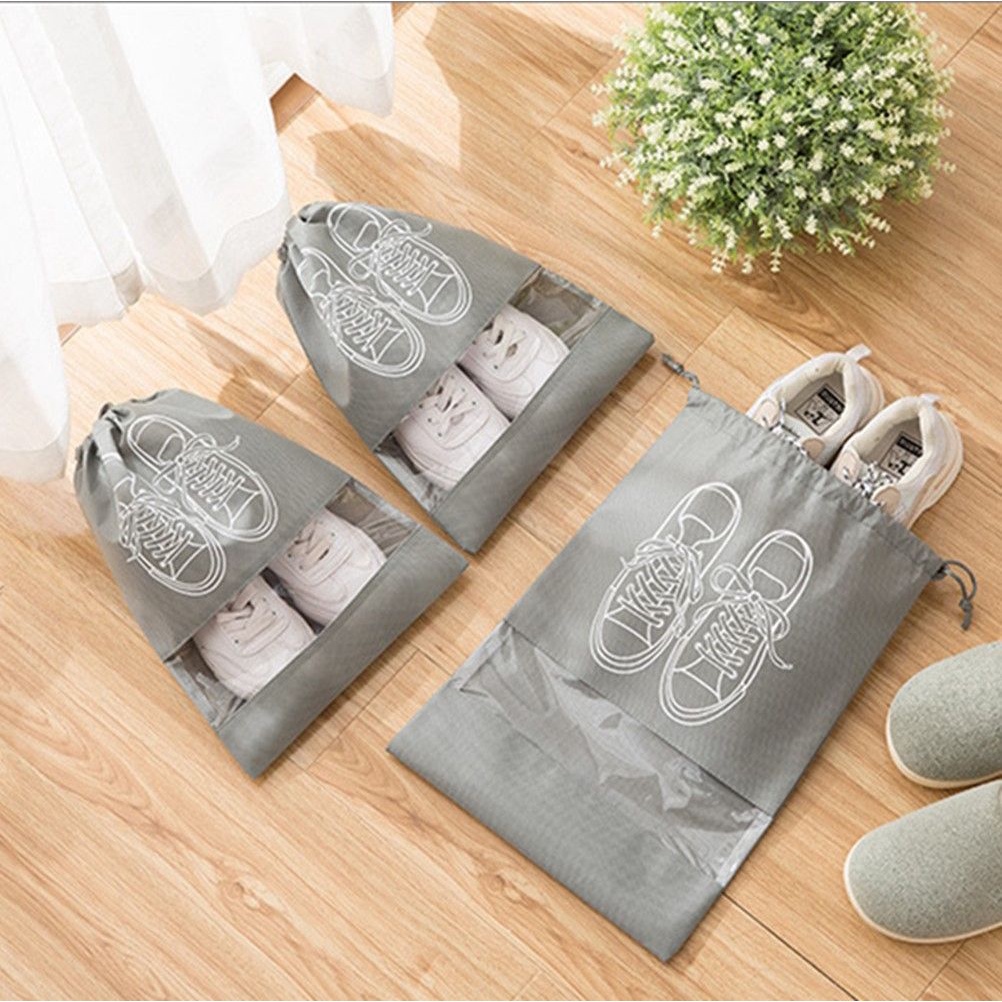 Túi Đựng Giày Mang Đi Du Lịch Chất Liệu Vải Không Dệt Dày Dặn Có Dây Rút Gọn Nhẹ Nhiều Màu Sắc