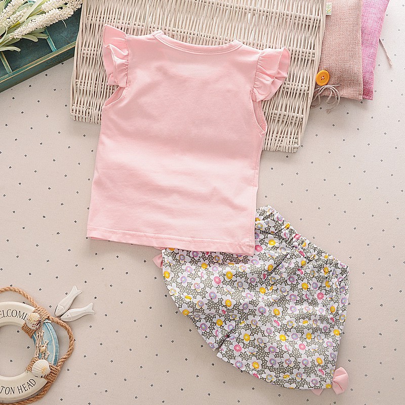 Bộ áo thun tay ngắn in hình kẹo mút + quần ngắn hoa đính nơ đáng yêu dành cho bé