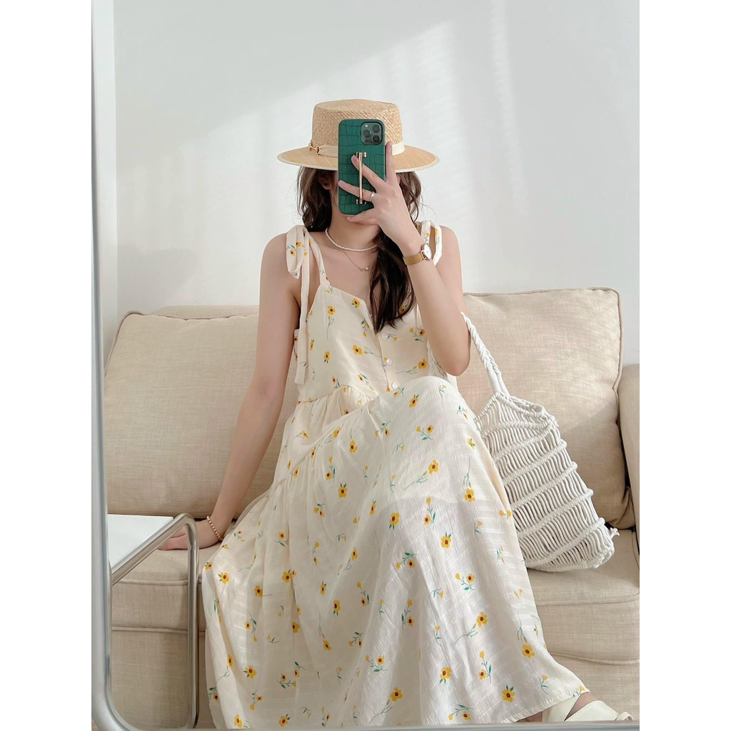 Váy 2 dây nơ vai hoa cúc vàng đũi mềm xinh xắn - Đầm maxi đi biển 2 dây hoa cúc vàng dáng xoè tầng Kozoda D74