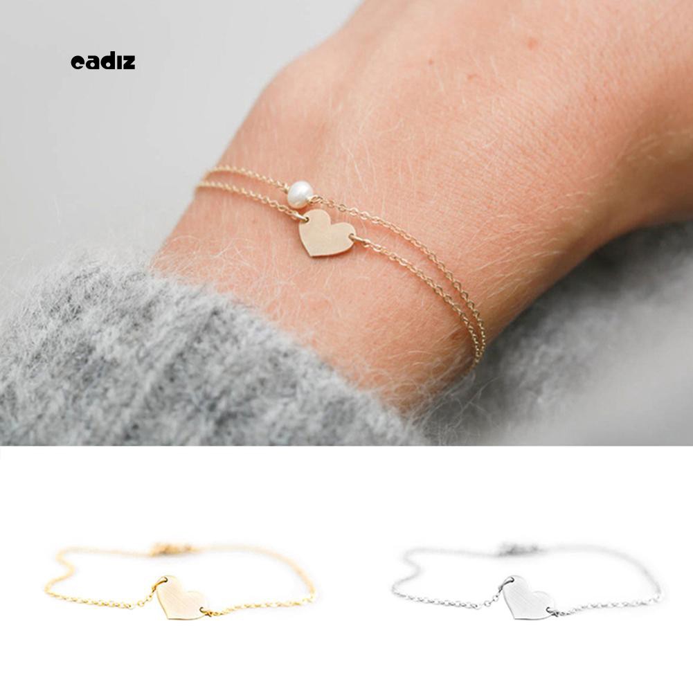 Vòng tay đính hạt giả ngọc trai trái tim