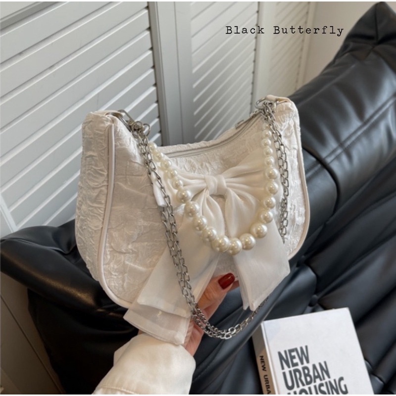 Túi đeo chéo đính nơ vải sần Butterfly