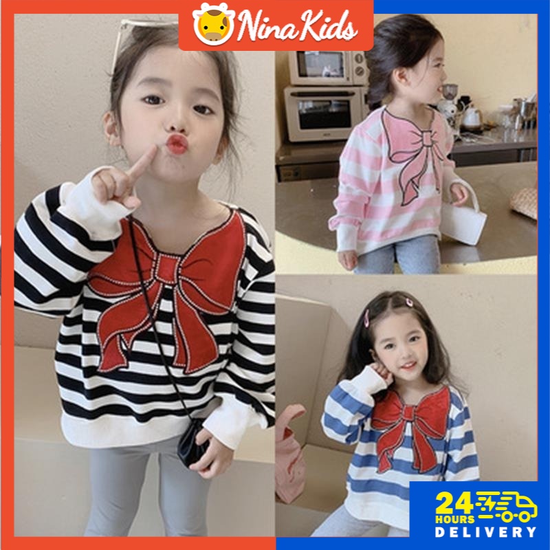 Áo thun Nina Kids tay dài họa tiết kẻ sọc dành cho bé gái 1-7 tuổi