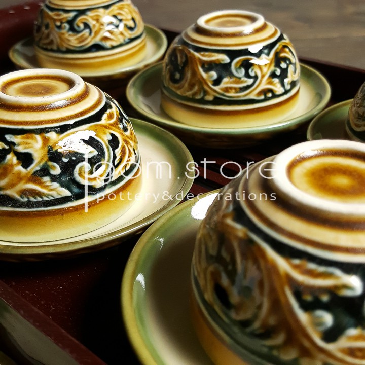 Ấm chén Bát Tràng khắc tay hoa dây nổi dáng vại men xanh đồng