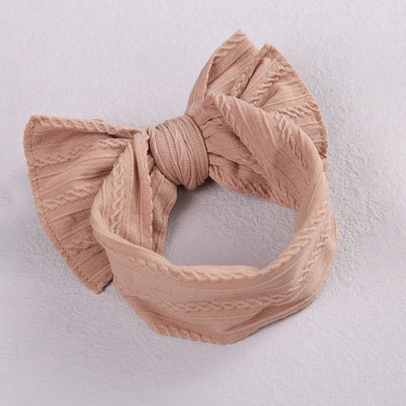 Băng đô thắt nơ chất liệu nylon co giãn mềm mại màu trơn dành cho bé gái