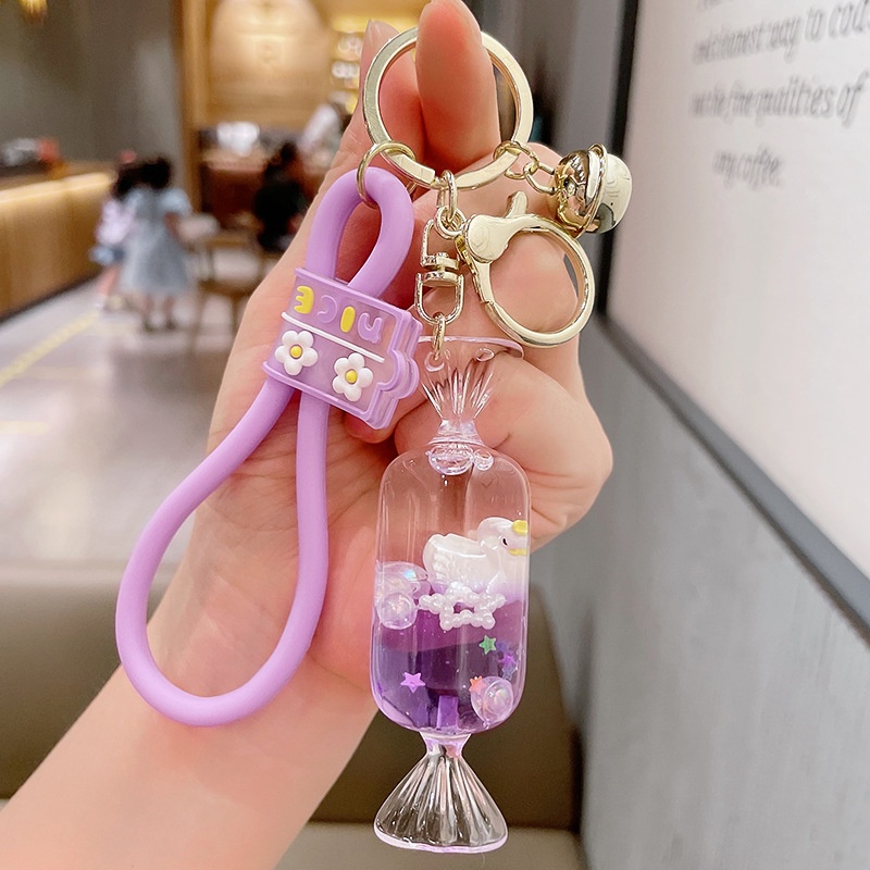 Móc Khóa Hình Thiên Nga Hoạt Hình Nổi Trên Nước Màu Tím Dễ Thương