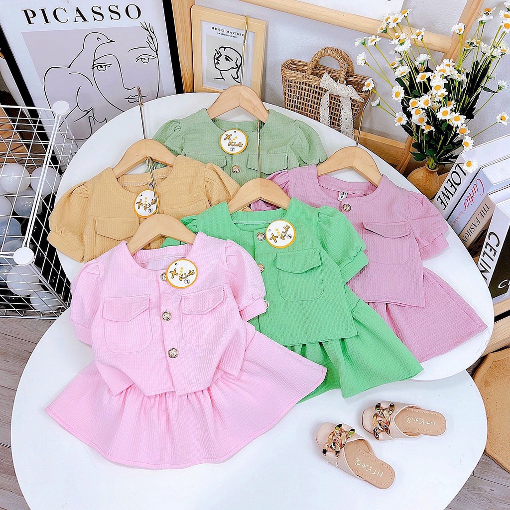 Set váy xốp tổ ong nắp túi ngực bé gái