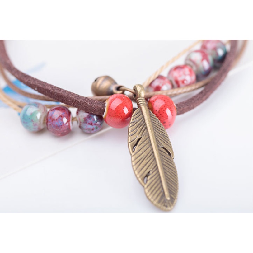 Vòng đeo tay hạt gốm lông vũ Clovershop68