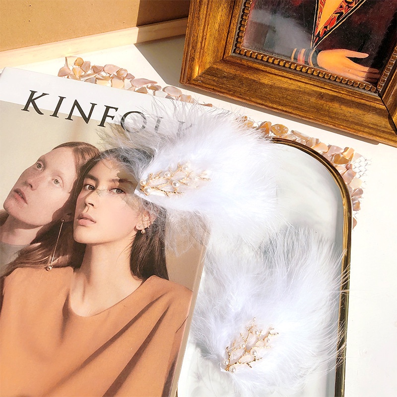 Kẹp tóc hình lông vũ phong cách Hàn Quốc thời trang đơn giản cho nữ
