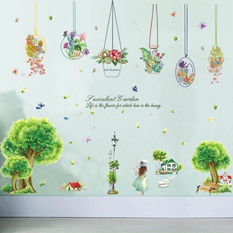 Decal dán tường giỏ hoa và cây xanh cô gái