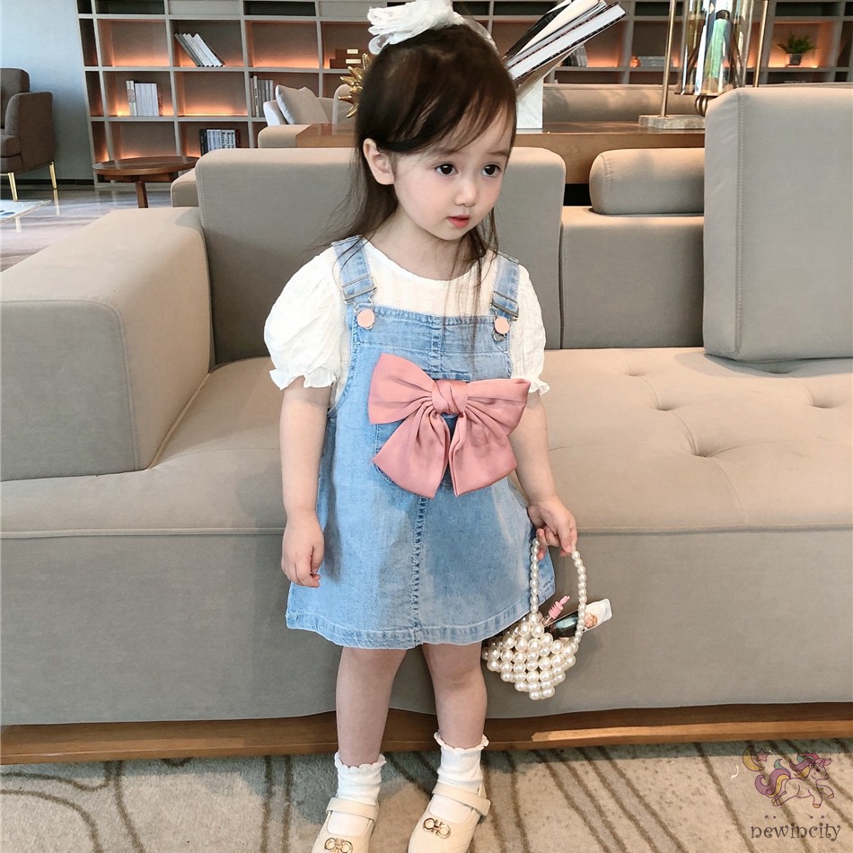 Đầm yếm denim đính nơ thắt xinh xắn thời trang dành cho bé gái