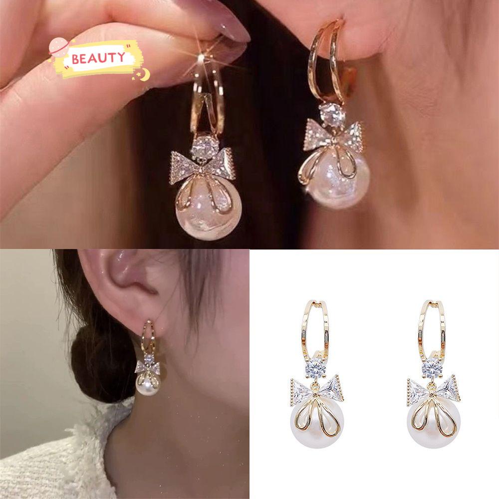 Đôi Bông Tai Hình Nơ Chữ C Đính Ngọc Trai Thời Trang Cho Nữ