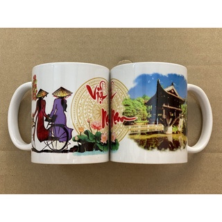 1 Ly sứ lưu niệm Việt Nam ( ly in 3 vị trí - cô gái + trống đồng + địa danh)