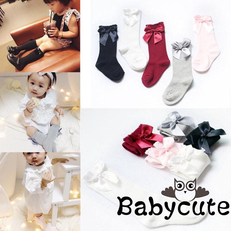 Đôi vớ dài đính nơ màu đơn sắc xinh xắn cho bé gái