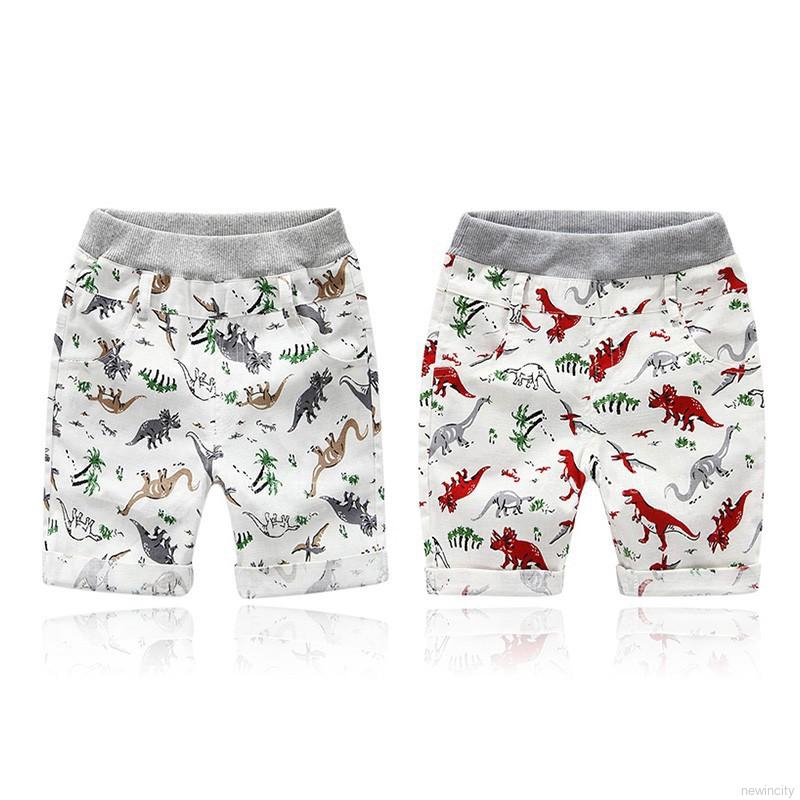 Quần short đi biển in hình khủng long dễ thương cho bé trai