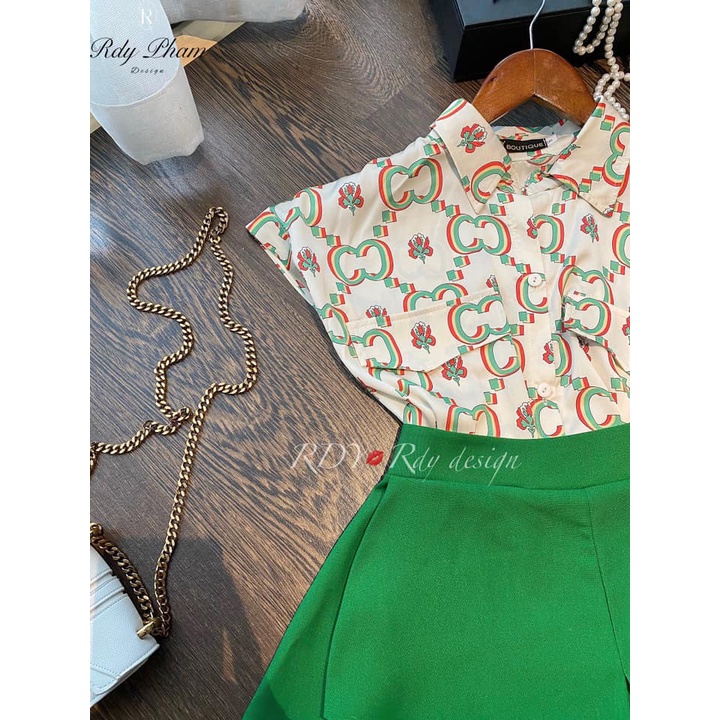 Áo guci+ váy xanh lá
