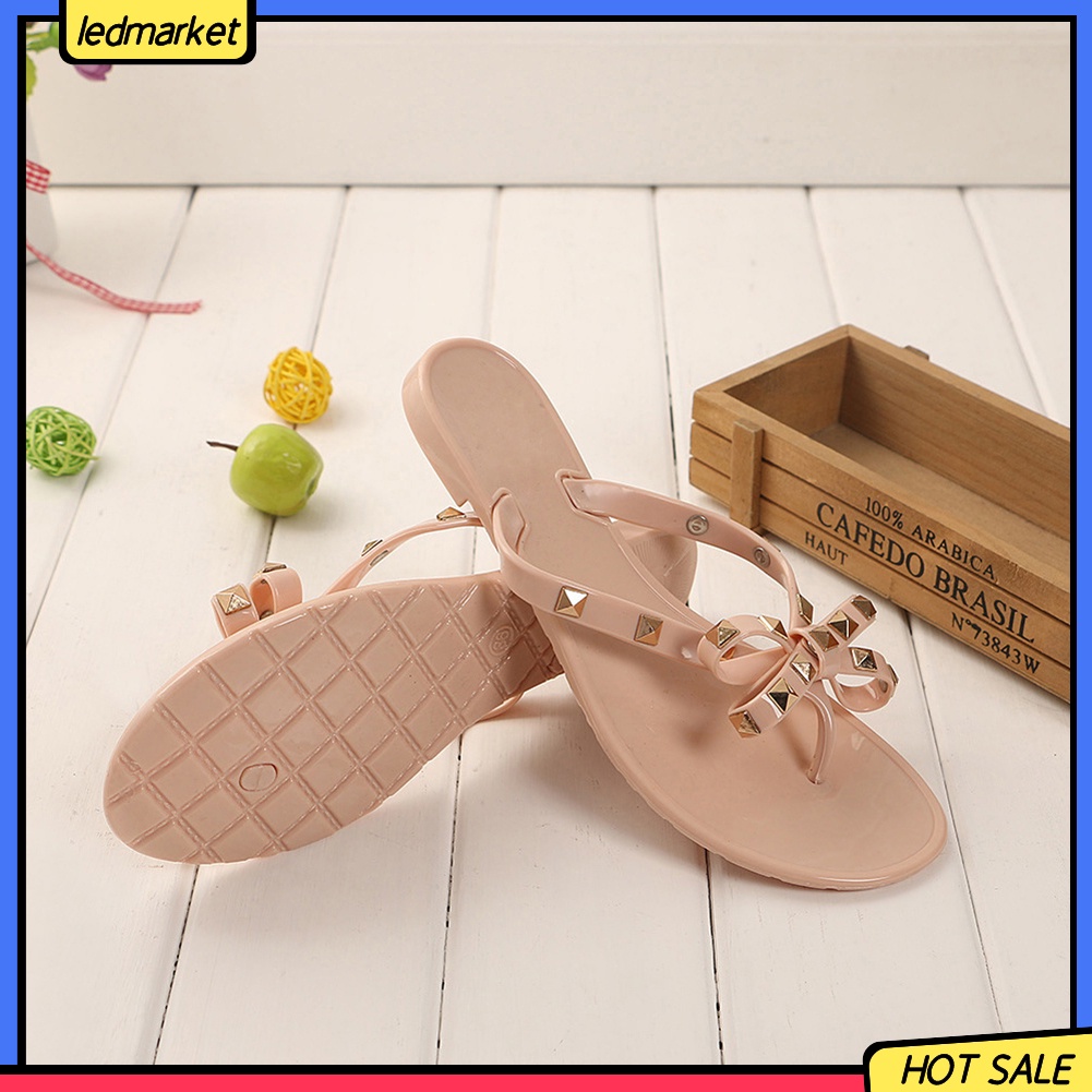 Dép đi biển phối nơ và đinh thời trang mùa hè dành cho nữ