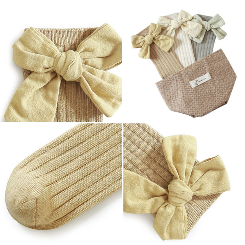Đôi tất chân cotton dài đính nơ dễ thương cho bé