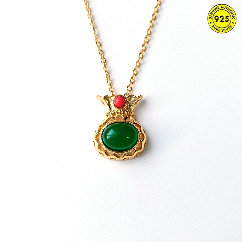 Dây chuyền may mắn hình túi xách đính ngọc lục bảo