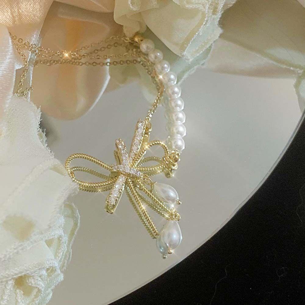 Vòng cổ Hai Lớp Đính Ngọc Trai Và Nơ Kim Loại Sang Trọng Cho Nữ