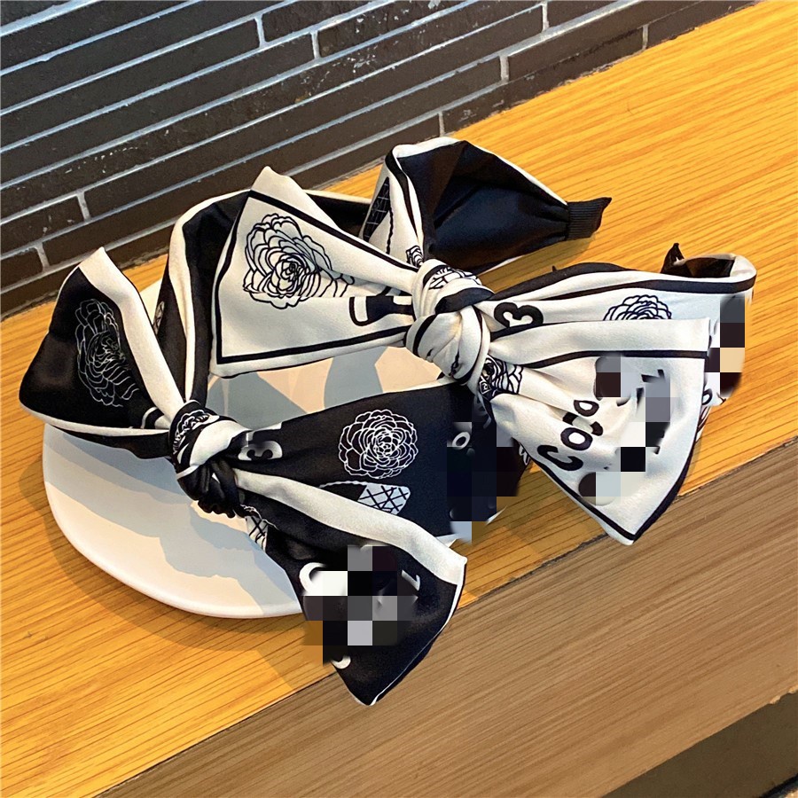 Bờm tóc thương hiệu CC hoa trà sang chảnh bản to TB576