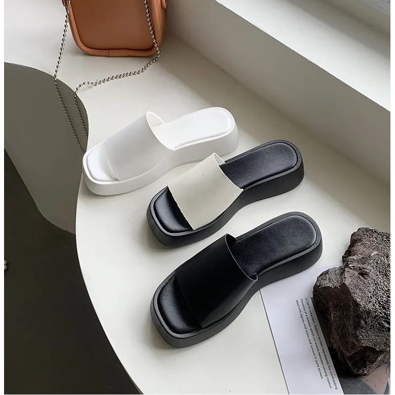 Black wedge platform flip-flops